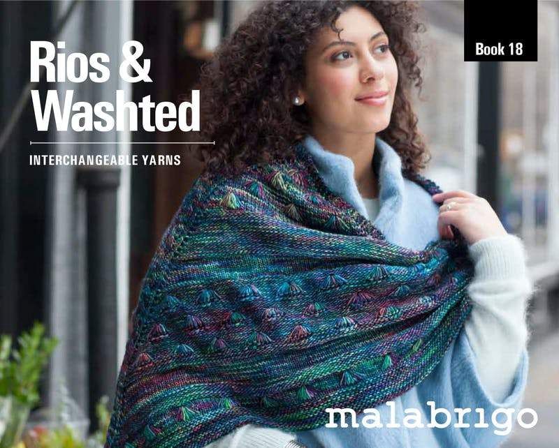 The front cover of the book, showing a woman wearing a variegated teal knitted shawl.