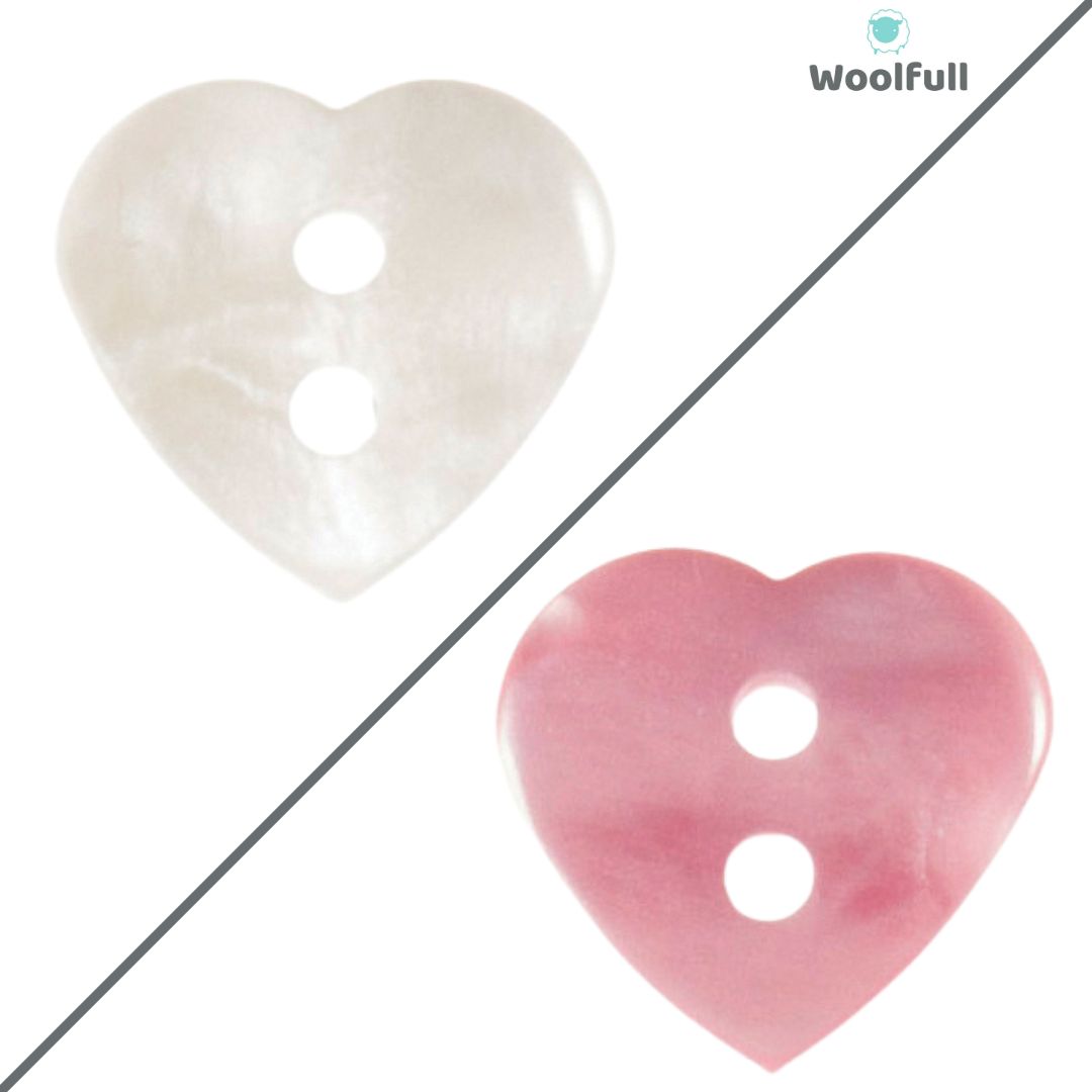 2 heart shaped buttons, 1 white and 1 pink.