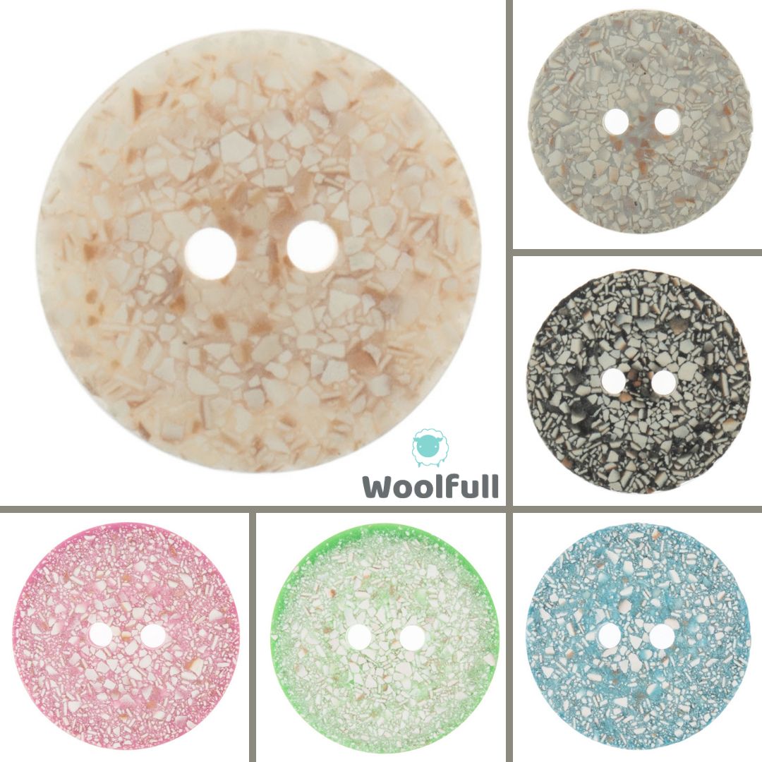 6 eggshell buttons, in cream, grey, black, pink, blue and green.