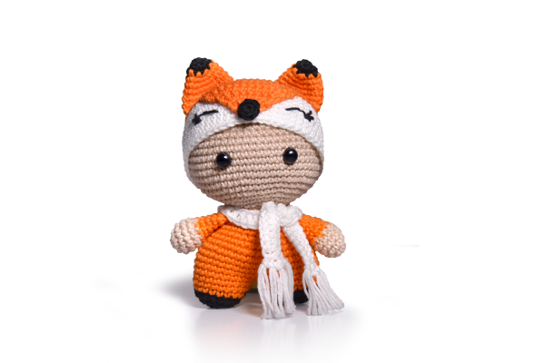 An orange crocheted fox toy.