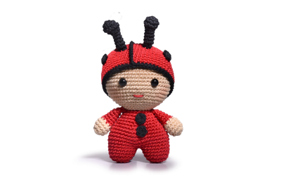 A red and black crocheted ladybug toy.