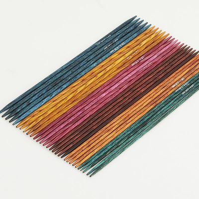 6 sets of wooden double pointed needles in various colours.