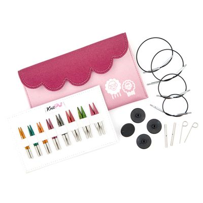 8 pairs of wooden interchangeable knitting needles, a pink fabric case, 4 circular cables, end caps and keys.