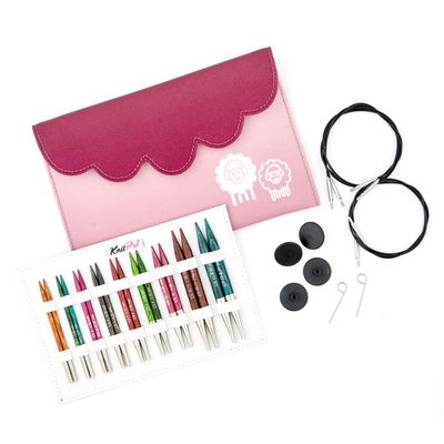 9 pairs of wooden interchangeable knitting needles, a pink fabric case, 2 circular cables, end caps and keys.