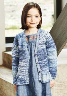 A girl is wearing a knitted cardigan in a variegated blue yarn.