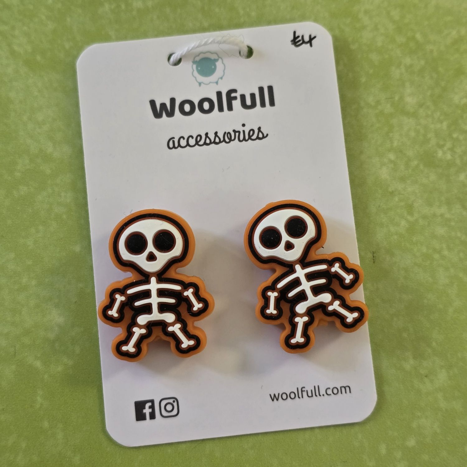 Cartoon skeleton point protectors mounted on a Woolfull card on a lime green background.
