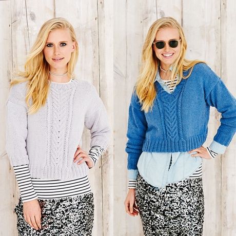 A woman is wearing a light grey knitted sweater with cable down the front on the left, and a blue knitted sweater with cable down the front on the right.