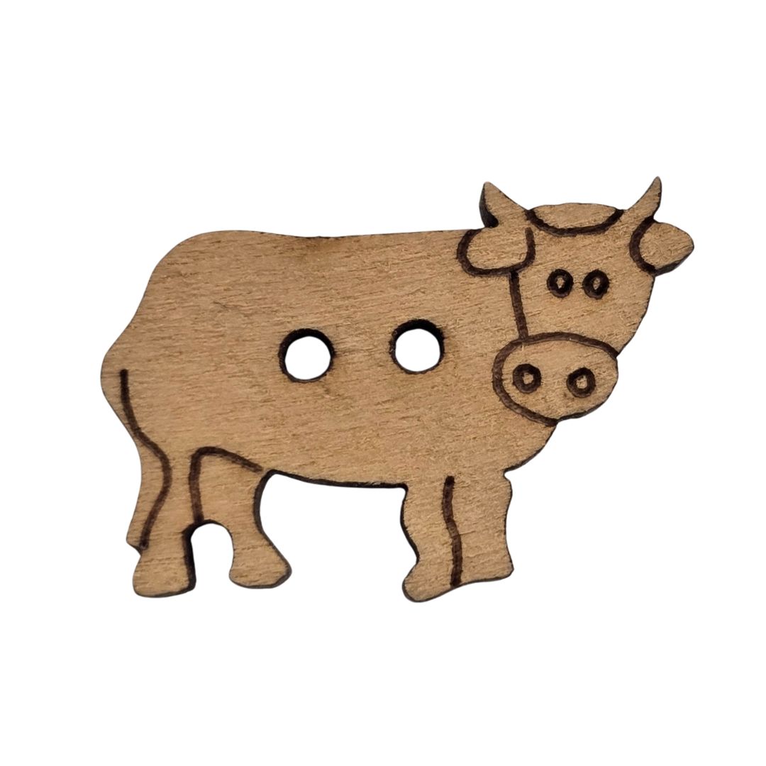 A brown wooden cow shaped button.