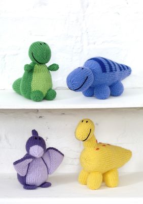 4 knitted dinosaurs in blue, yellow, purple and green.