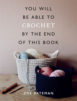 The front cover of the book, showing balls of yarn in crocheted baskets.