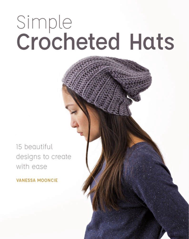 The front cover of the book, showing a woman wearing a grey crocheted hat.