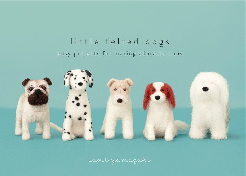 The front cover of the book, showing several needle felted dogs.