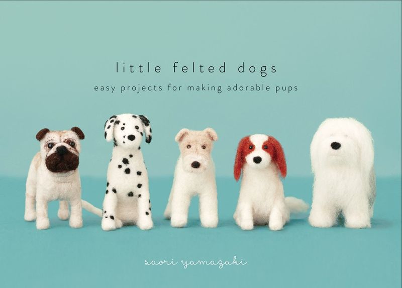 The front cover of the book, showing several needle felted dogs.