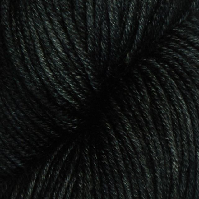 A close up of the yarn, in very dark grey.