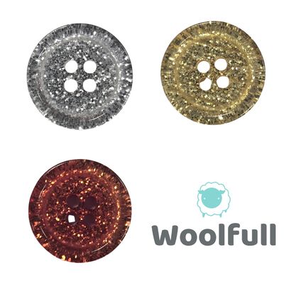 3 glittery buttons, 1 silver, 1 gold and 1 red.