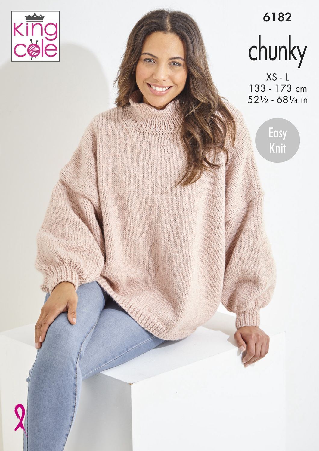 A woman is wearing a pink knitted sweater.
