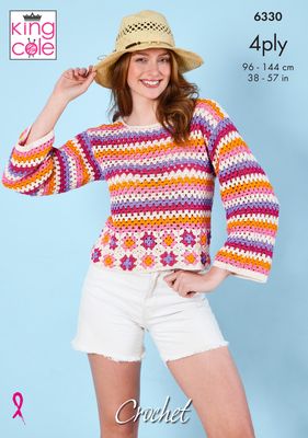 A woman is wearing a striped crocheted sweater in bright orange, purple, pink and white.