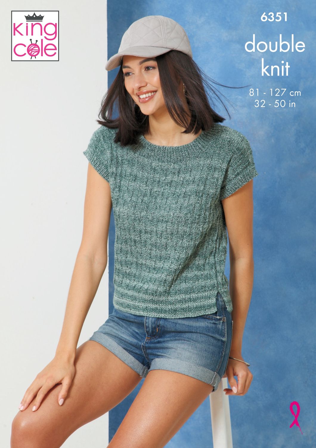 A woman is wearing a teal green knitted top.