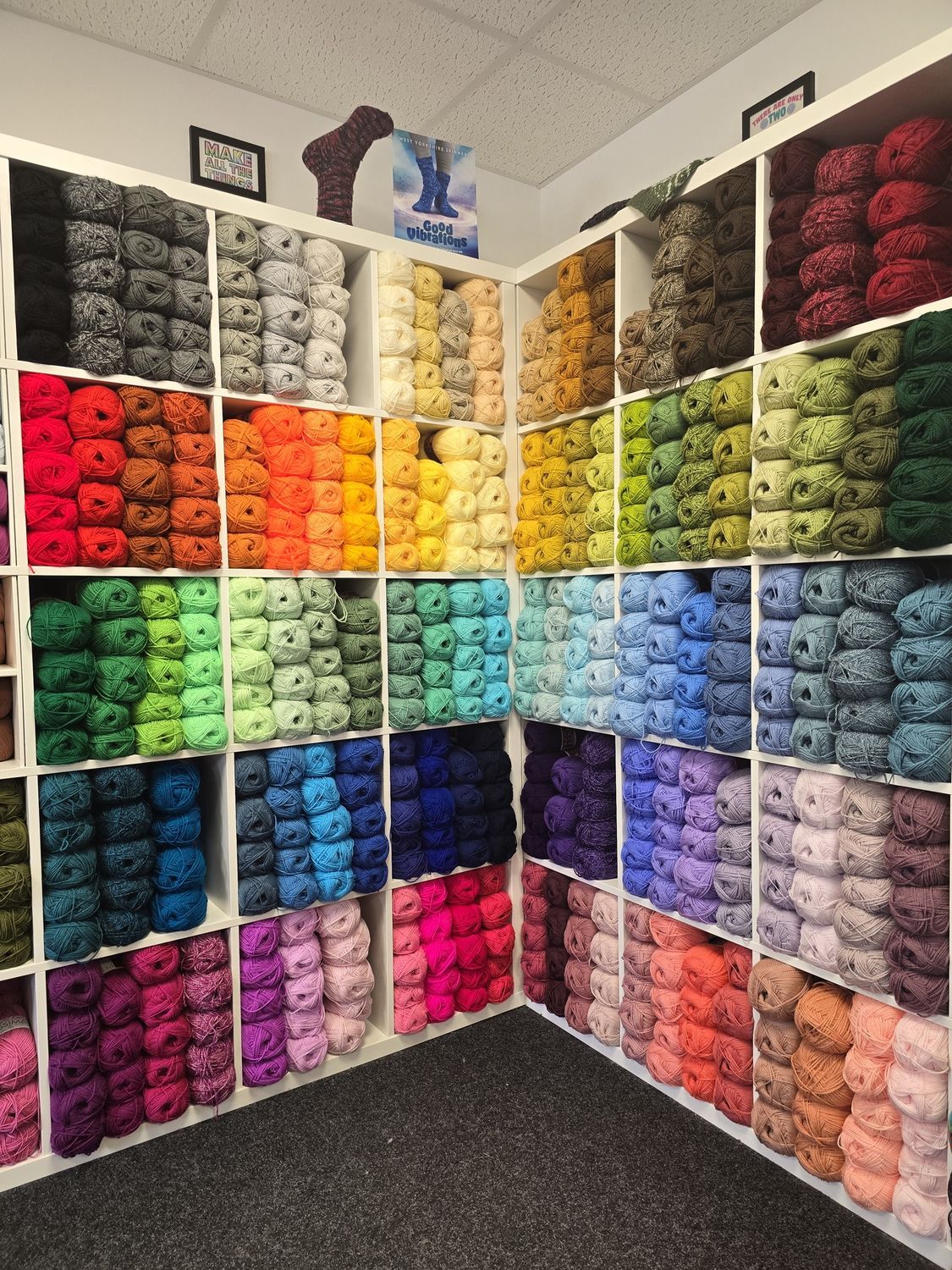 Cube shelving holding 122 colours of yarn.