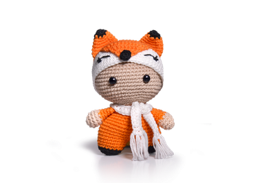 An orange crocheted fox toy.