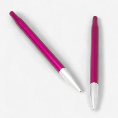 A pair of pink metal interchangeable needles.
