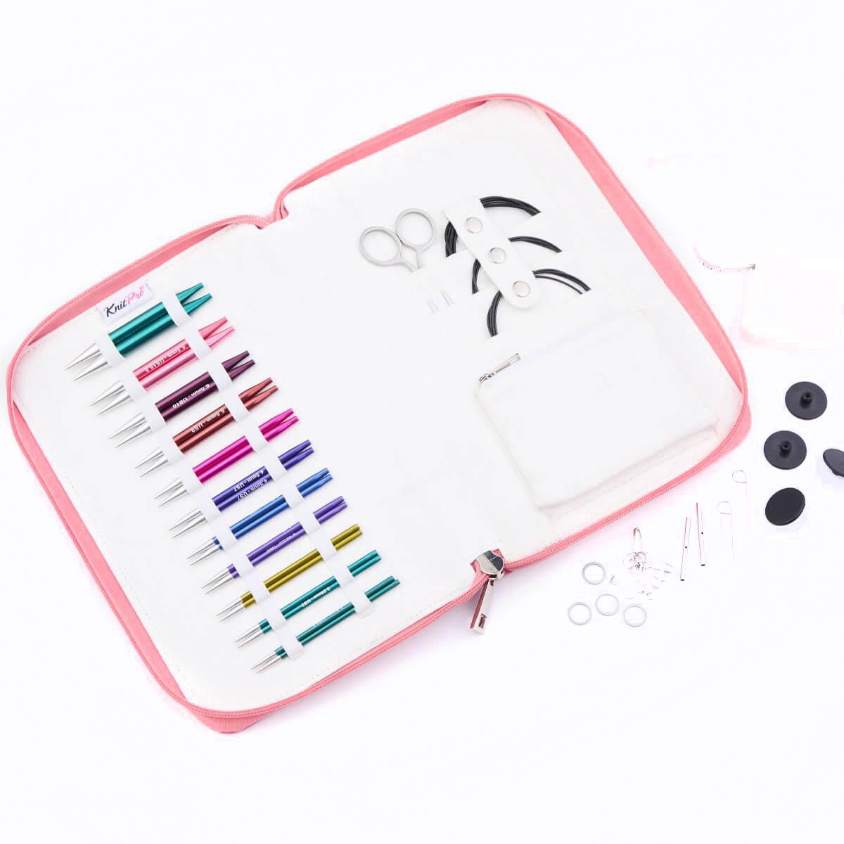 The needle set opened up, showing all contents.