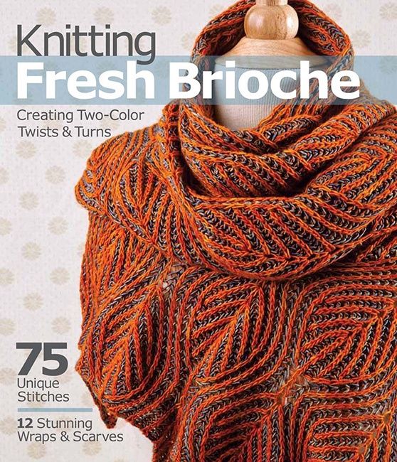 The front cover of the book, showing an orange knitted brioche shawl.