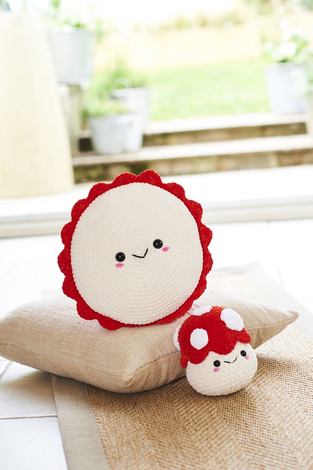 A crocheted toadstool toy and matching cushion.