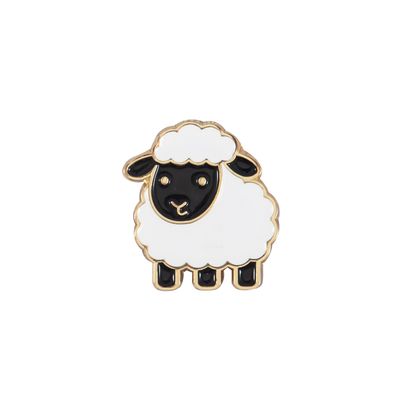 A sheep shaped enamel needle minder.