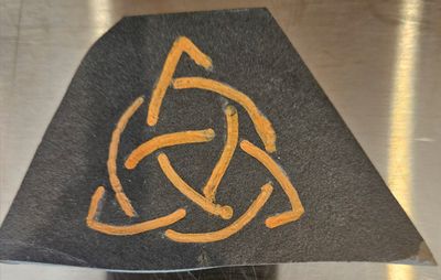 Triskele Carved into Stone