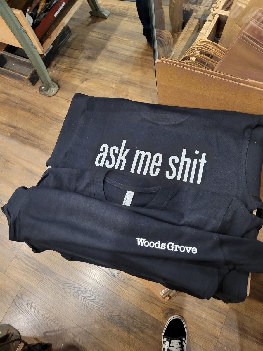 Woods Grove Ask Me Shit Holiday Employee Short Sleeve Tee