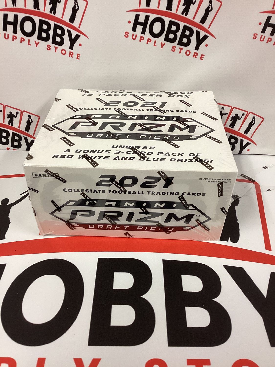 2021 PANINI PRIZM DRAFT PICKS FOOTBALL FACTORY SEALED CELLO BOX (12 PACKS) ( wrap has small tear )