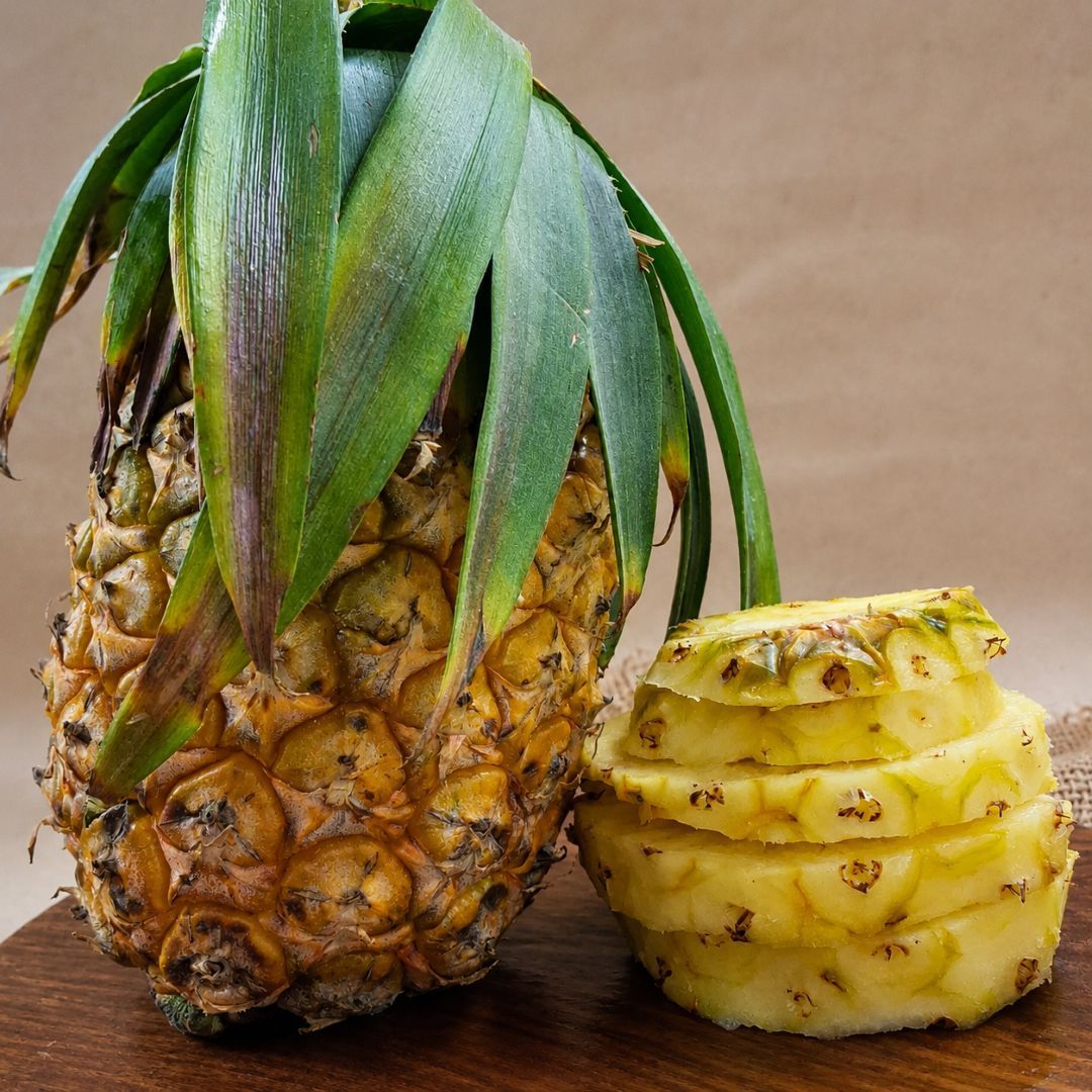 Organic Queen Pineapple with golden, juicy slices, showcasing its fresh tropical texture and natural sweetness.
