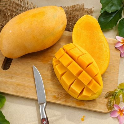 Organic Mallika mangoes with golden skin and juicy orange flesh, naturally ripened for rich sweetness.