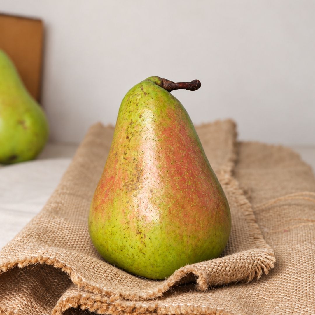 Organic Concorde pear with smooth green skin, naturally sweet flavour and firm, juicy flesh, fresh from Sanesa.