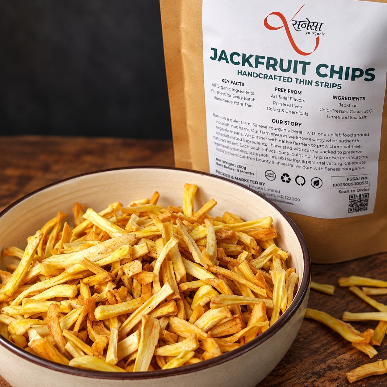 Sanesa Jackfruit Chips served in a bowl beside the pack, showcasing their thin, crisp texture.