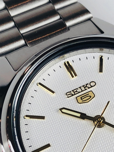 Reloj Seiko 5 SNXG47K1 automático plateado y dorado