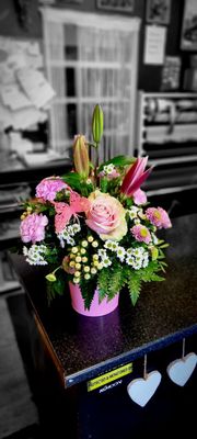 Pink arrangement in container