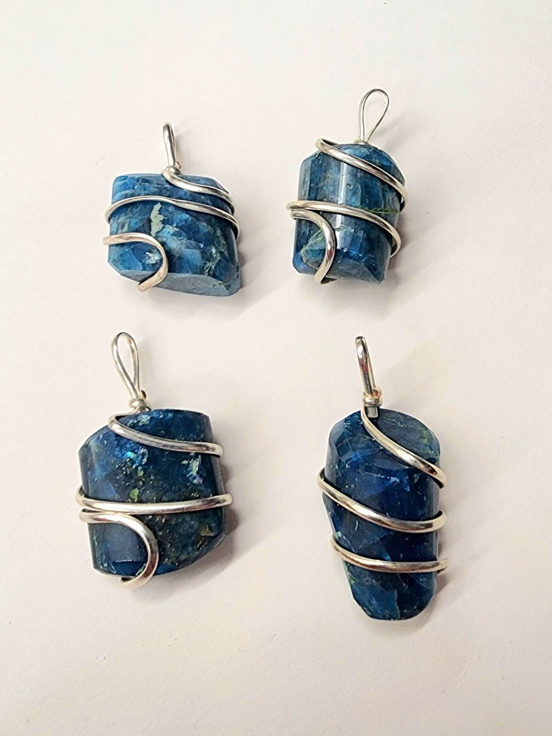 Blue Apatite Wrapped Pendants on Black Cord