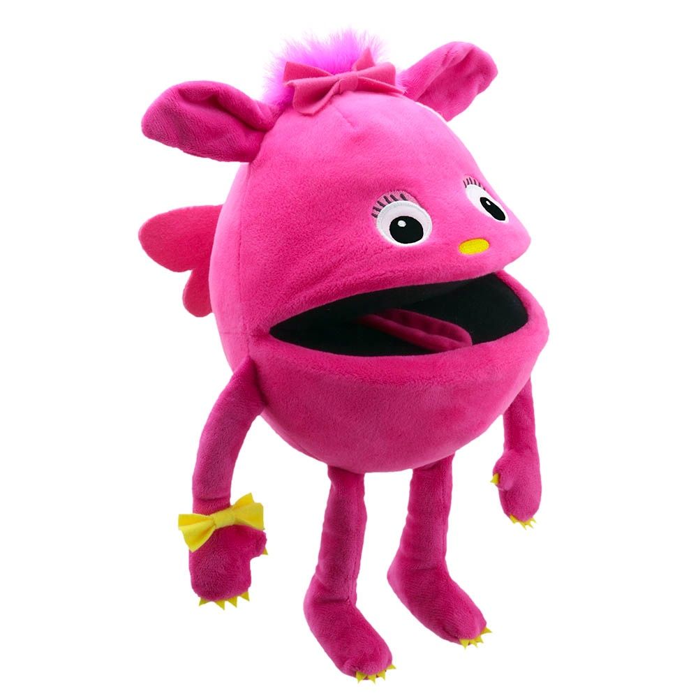 Pink monster puppet with tufty hair and friendly smile