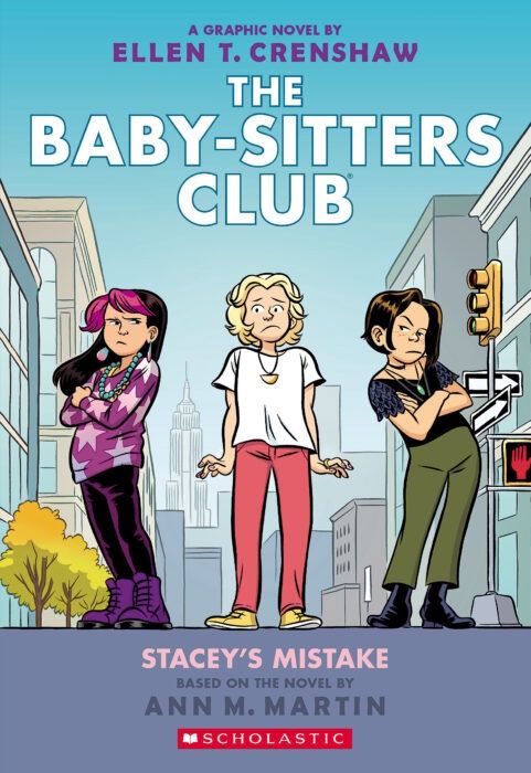 Cover of 'The Baby-Sitters Club #14: Stacey’s Mistake' graphic novel, illustrated by Ellen T. Crenshaw, featuring Stacey, Claudia, and Mary Anne standing on a New York City sidewalk with the Empire State Building in the background.