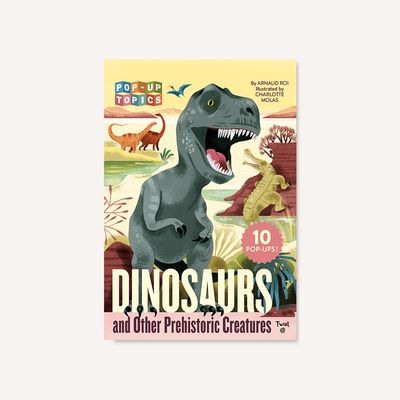 Pop-Up Topics: Dinosaurs and Other Prehistoric Creatures Cover of "Pop-Up Topics: Dinosaurs and Other Prehistoric Creatures" featuring a roaring T. rex in a prehistoric landscape with other dinosaurs in the background.