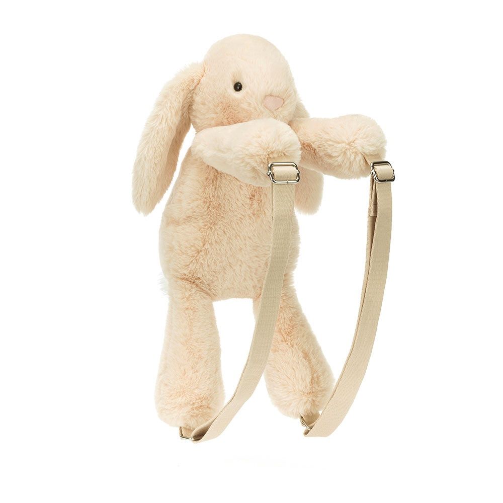 Jellycat Smudge Rabbit Backpack featuring soft oatmeal fur, floppy ears, and a fluffy white tail