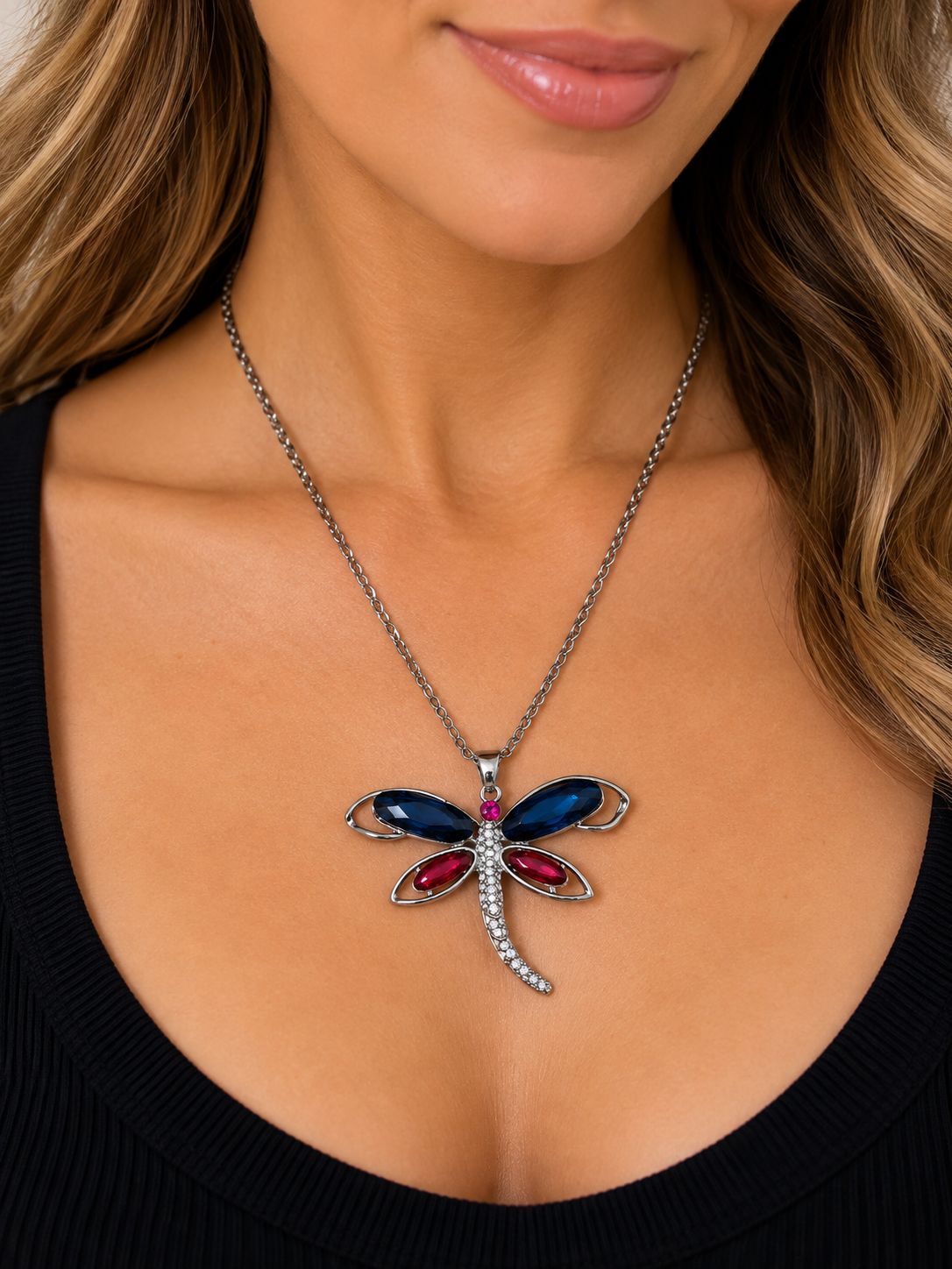 silver tone dragonfly necklace
necklace with pink and turquoise gems in the center 