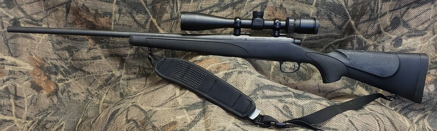 USED REM 700 SPS 243WIN W/ NIKON PROSTAFF 4-12X40 SCOPE AND SLING