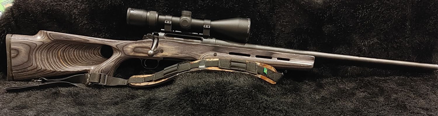 USED REM 770 300 WIN GREY LAM BOLT PKG