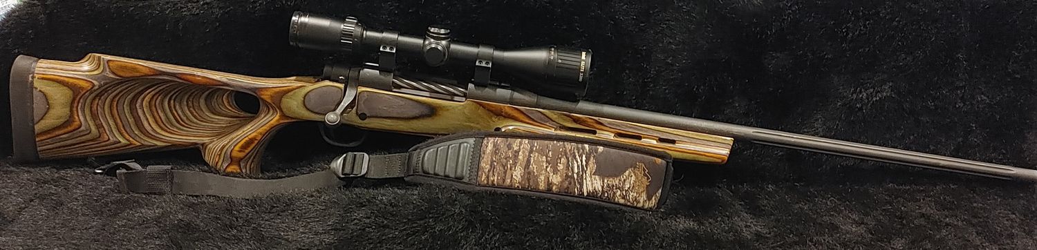 USED MOSS 4X4 338 WIN MULTI COLOR LAMINATED THUMHOLE BOLT PKG