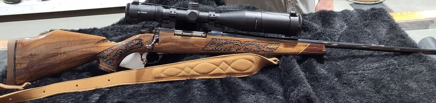 CONSIGN WBY MARK V LAZERMARK W/ VORTEX VIPER 4-16X50 BDC AND 4 BOXES OF AMMO