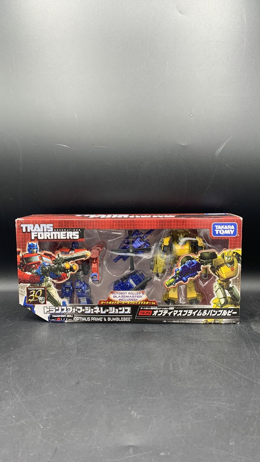 Takara Tomy Transformers TG-24 Optimus Prime and Bumblebee Figures 2014
