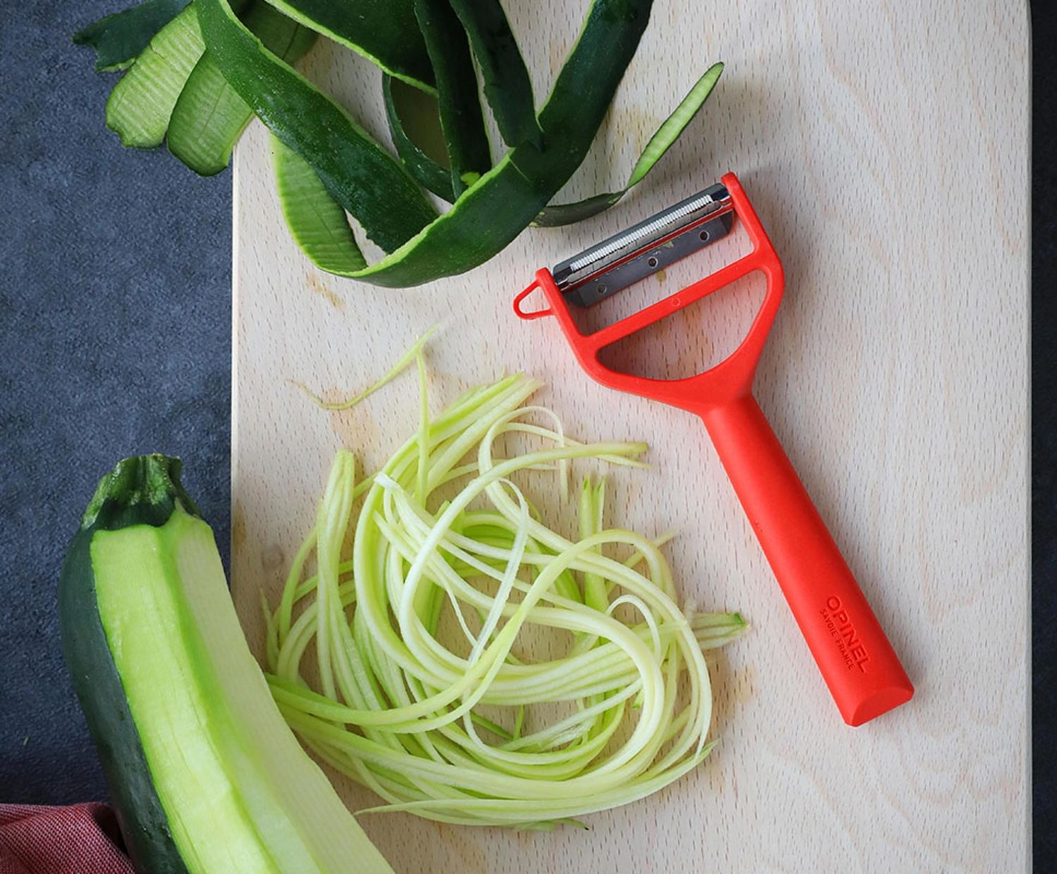 Eplucheur T DUO bois et rouge pour droitiers + gauchers